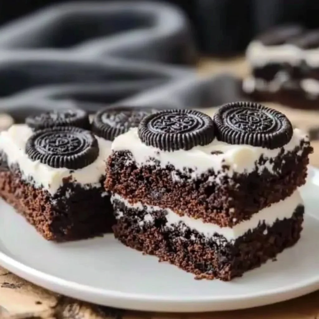 Deliciously decadent Oreo brownies with cookie pieces and chocolate frosting