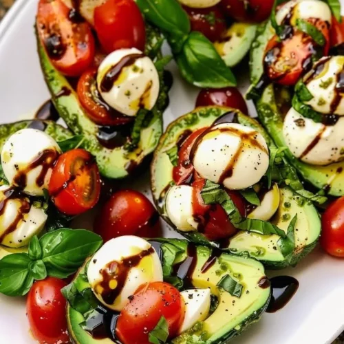 Delicious Avocado Caprese Boats filled with tomatoes and mozzarella