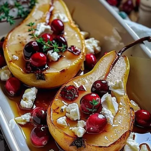Delicious baked pears topped with feta cheese, honey, and cranberries