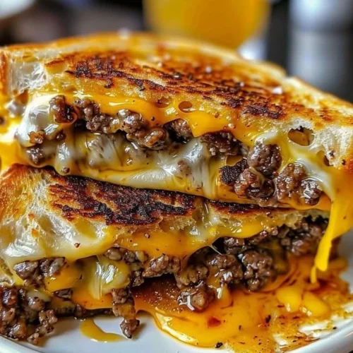 Delicious beef grilled cheese sandwich with gooey cheese and tender beef.