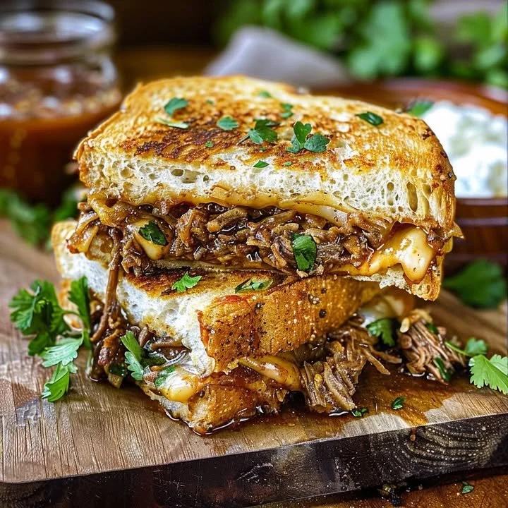 Delicious Birria Grilled Cheese sandwich with melted cheese and tender meat