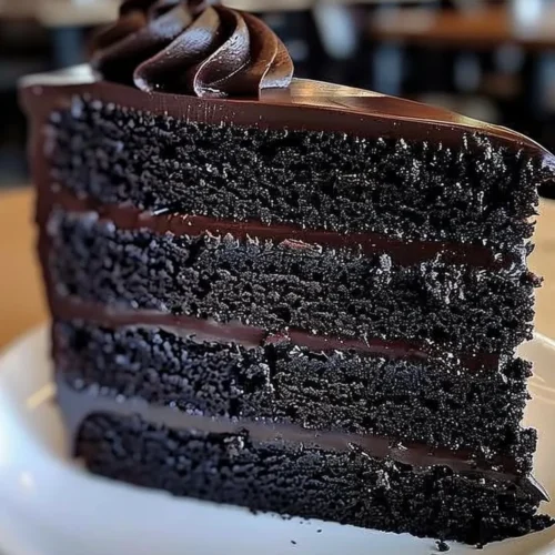 Delicious homemade Black Velvet Cake on a colorful dessert table.