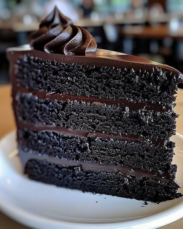 Delicious homemade Black Velvet Cake on a colorful dessert table.