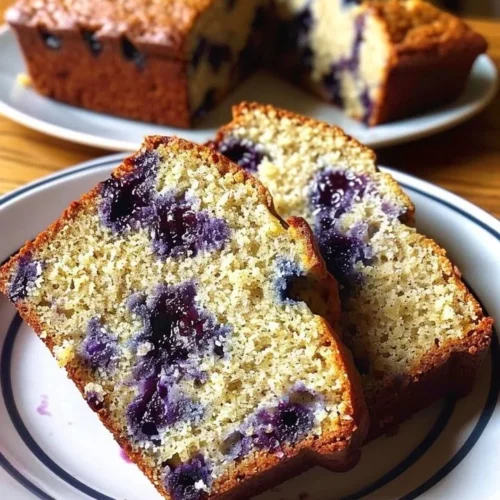 Freshly baked blueberry banana bread with ripe bananas and blueberries