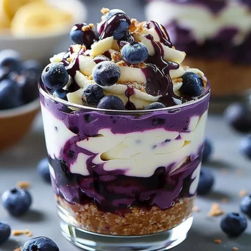 Delicious blueberry cheesecake parfait layered with fresh blueberries and creamy cheesecake