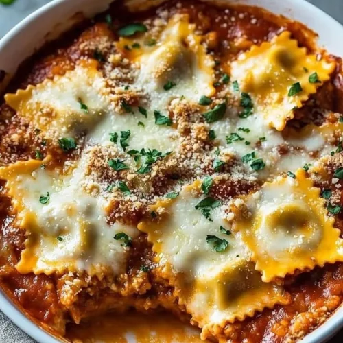 Cheesy baked ravioli casserole topped with melted cheese