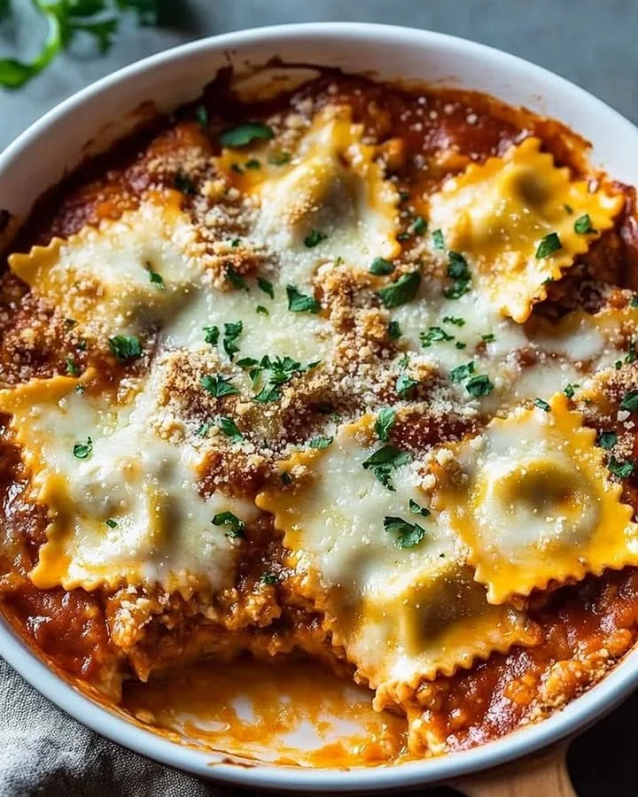 Cheesy baked ravioli casserole topped with melted cheese