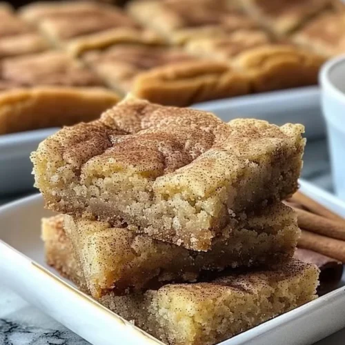 Chewy Snickerdoodle Cookie Bars sprinkled with cinnamon sugar