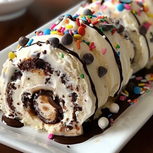 Delicious cookie dough ice cream cake rolls topped with chocolate chips.