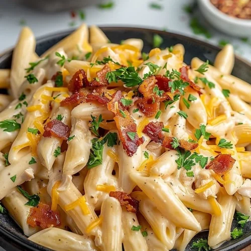 Delicious Crack Chicken Penne served in a creamy sauce with herbs