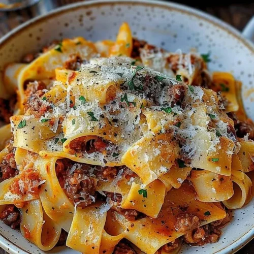 Creamy Calabrian Chili Pappardelle with sausage and fennel served in a bowl