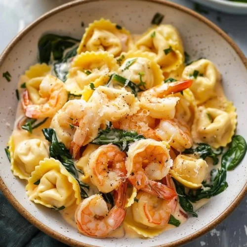 Creamy Lemon Shrimp Tortellini dish garnished with herbs and served in a bowl
