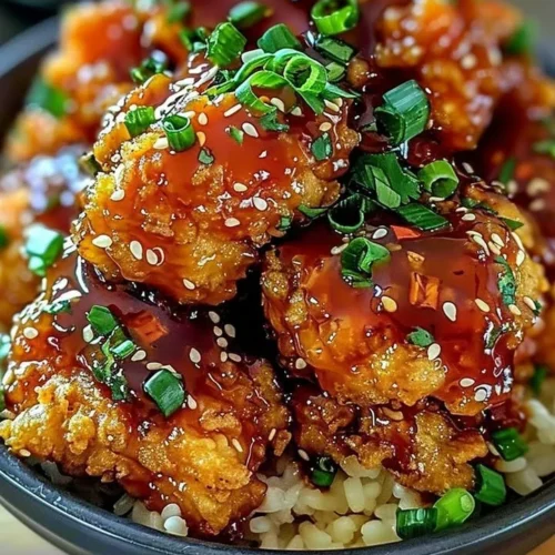 Crispy Bang Bang Chicken dish with sauce and garnishes