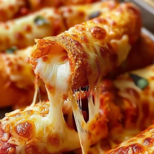 Delicious Doritos Pizza Rolls served on a plate with dipping sauce