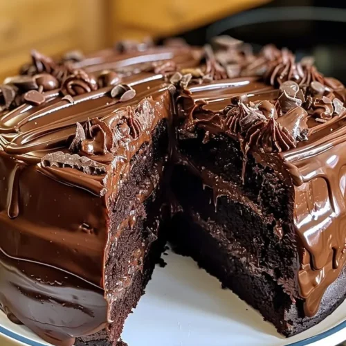 Delicious double chocolate Coca-Cola cake showcasing rich chocolate layers and a fizzy twist