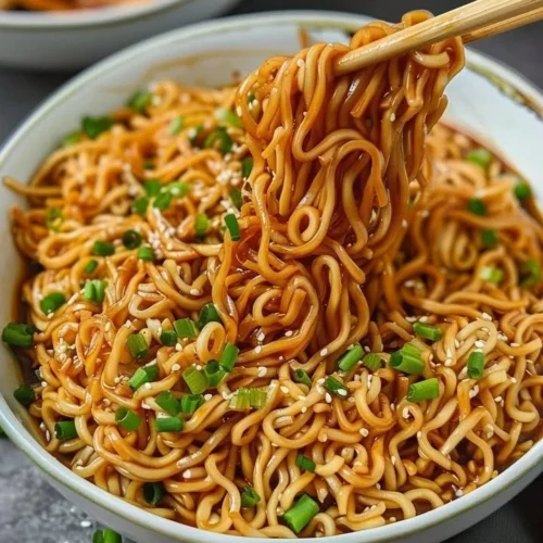 Delicious easy saucy ramen noodles with thick sauce and vibrant toppings.