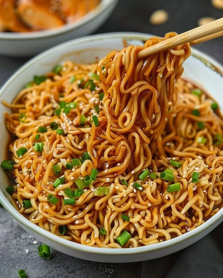 Delicious easy saucy ramen noodles with thick sauce and vibrant toppings.