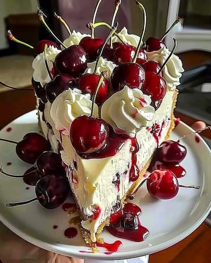 Elegant cherry cheesecake topped with fresh cherries and creamy filling.