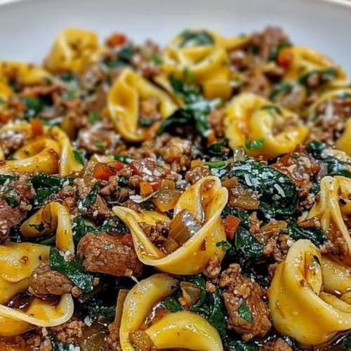 Delicious garlic butter beef and spinach tortellini served in a bowl