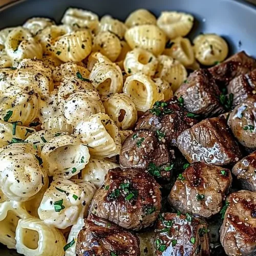 Delicious Garlic Butter Steak Bites served with creamy Parmesan pasta shells