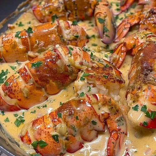 Garlic Parmesan Alfredo Lobster Tails plated elegantly with herbs