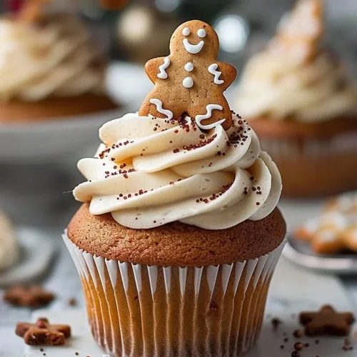 Decadent gingerbread cupcakes with icing and festive decorations