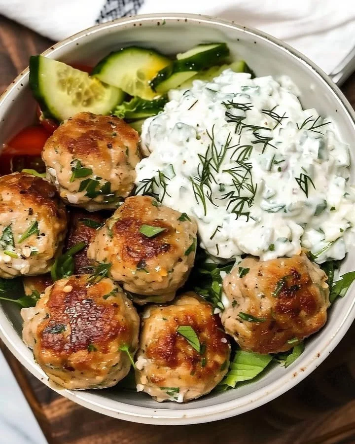 Plate of Greek chicken meatballs with homemade tzatziki sauce