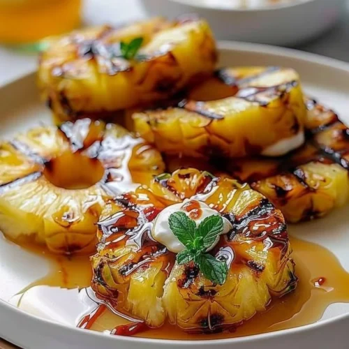 Delicious grilled pineapple slices on a barbecue grill