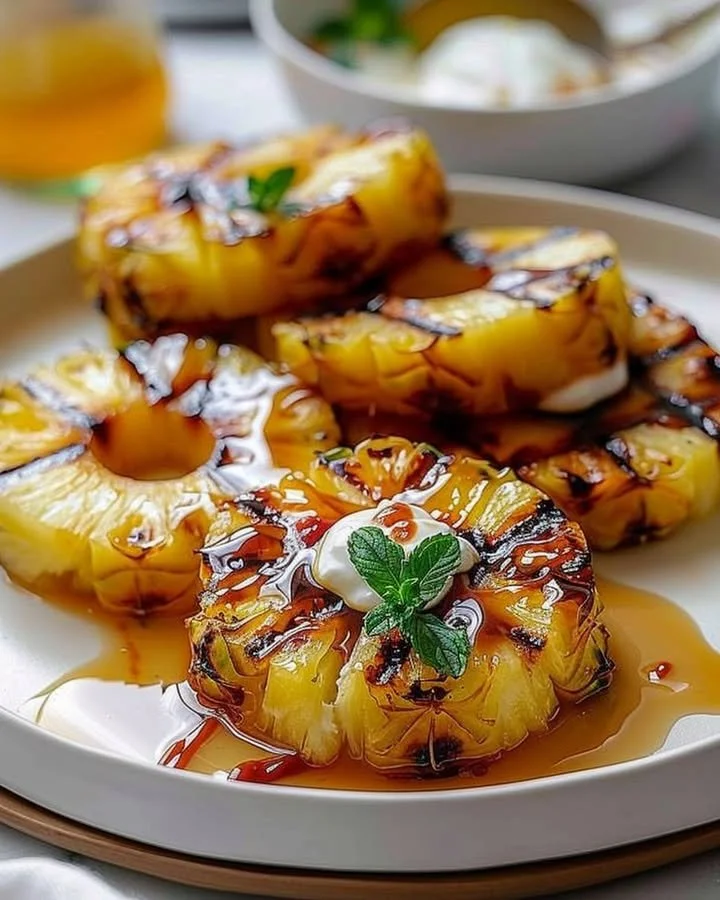Delicious grilled pineapple slices on a barbecue grill