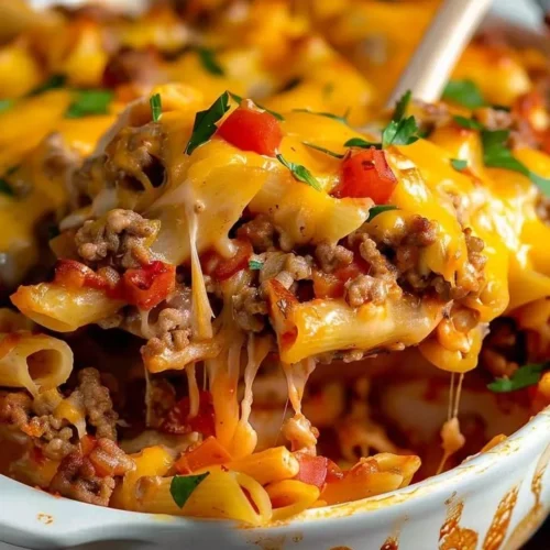 Delicious hamburger casserole served in a baking dish with toppings