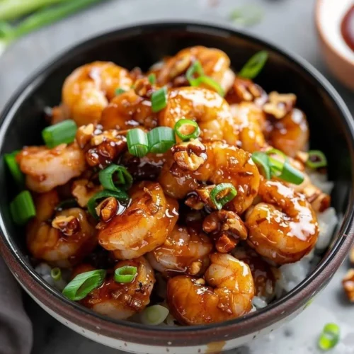 Delicious Honey Walnut Shrimp served on a plate with walnuts and sauce
