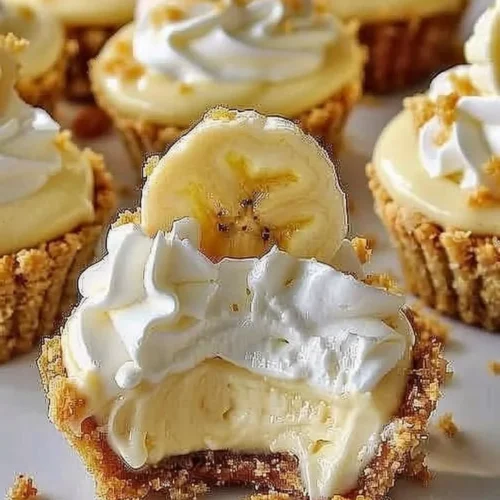 Delicious no-bake mini banana cream pies topped with sliced bananas and whipped cream