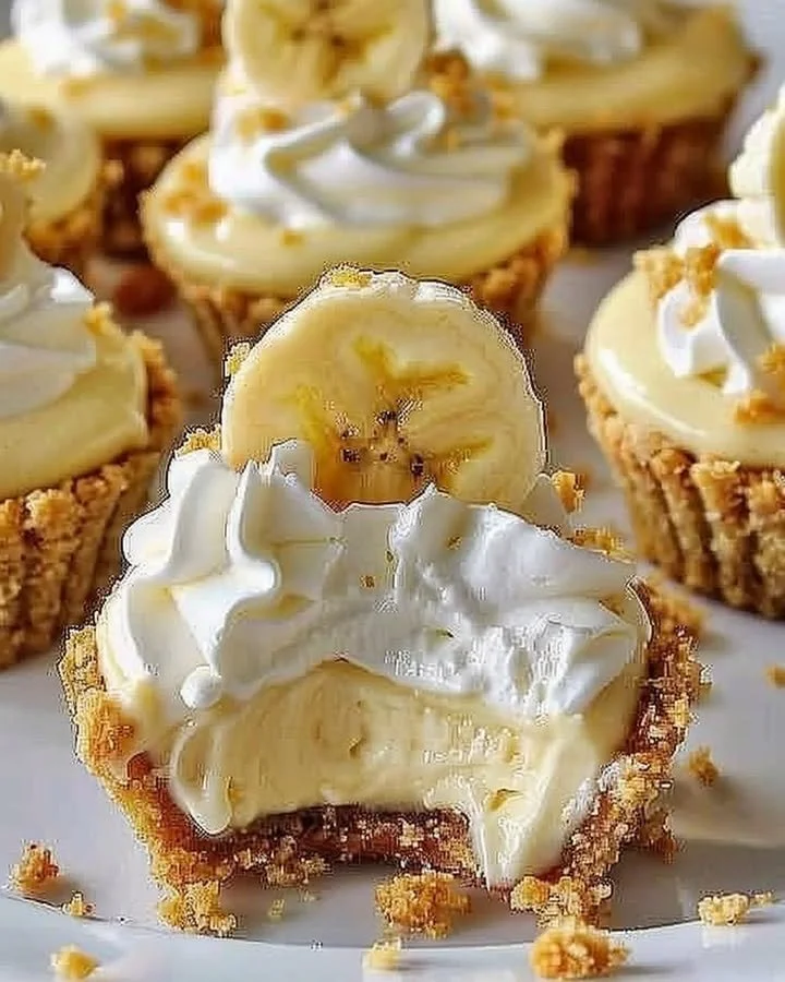 Delicious no-bake mini banana cream pies topped with sliced bananas and whipped cream