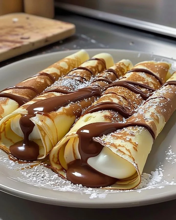 Delicious Nutella crepes filled with creamy goodness, perfect for dessert.
