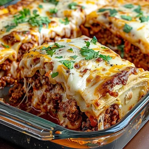 Pillsbury Crescent Roll Taco Bake topped with cheese and fresh ingredients