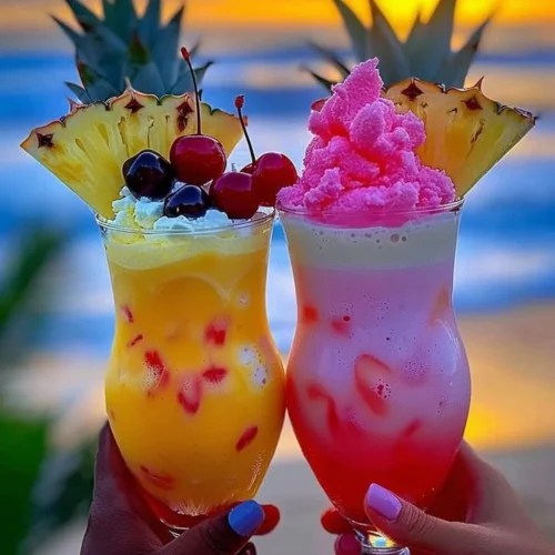 Colorful Rainbow Sherbet Piña Colada in a glass with tropical garnishes