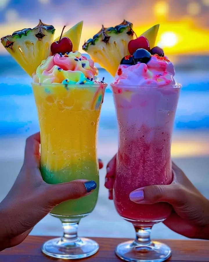 Colorful Rainbow Sherbet Piña Colada in a glass with a tropical garnish