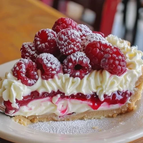 Delicious Raspberry Cheesecake Pie with fresh raspberries and cheesecake filling