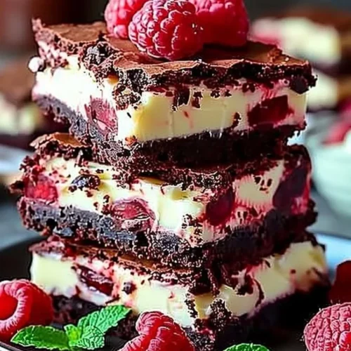 Delicious red velvet brownies on a plate with a fork