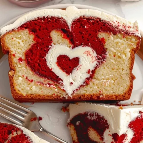 Delicious slice of Red Velvet Loaf Cake with cream cheese frosting on top