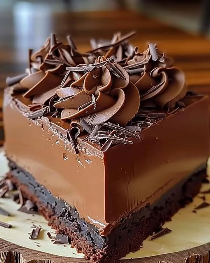 Rich chocolate mousse cake with a velvety texture and chocolate garnish