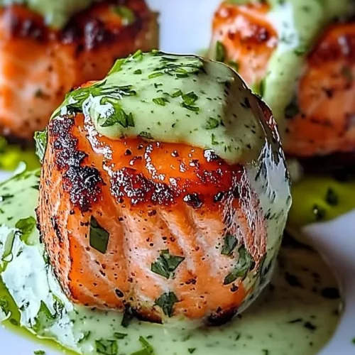 Salmon balls served with creamy avocado sauce on a plate