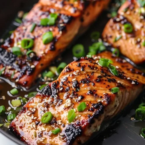 Silken Miso-Ginger Glazed Salmon served on a plate with garnishes