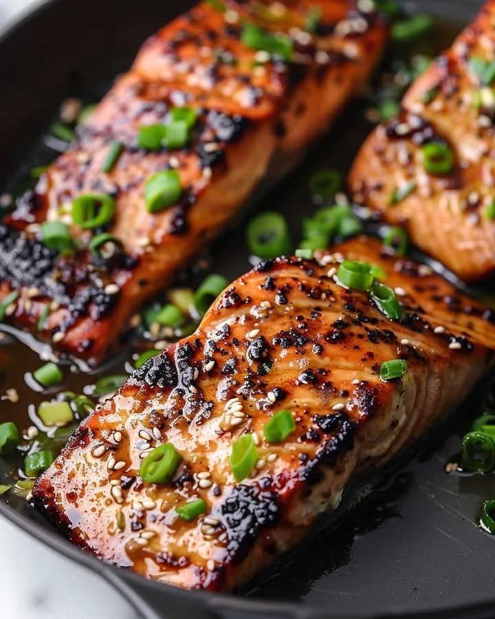 Silken Miso-Ginger Glazed Salmon served on a plate with garnishes