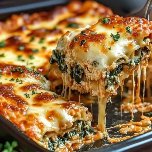 Delicious spinach lasagna layered with ricotta and three cheeses