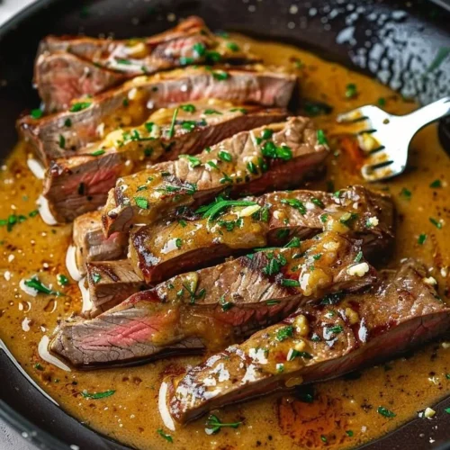 Succulent gourmet steak with herb butter on a plate