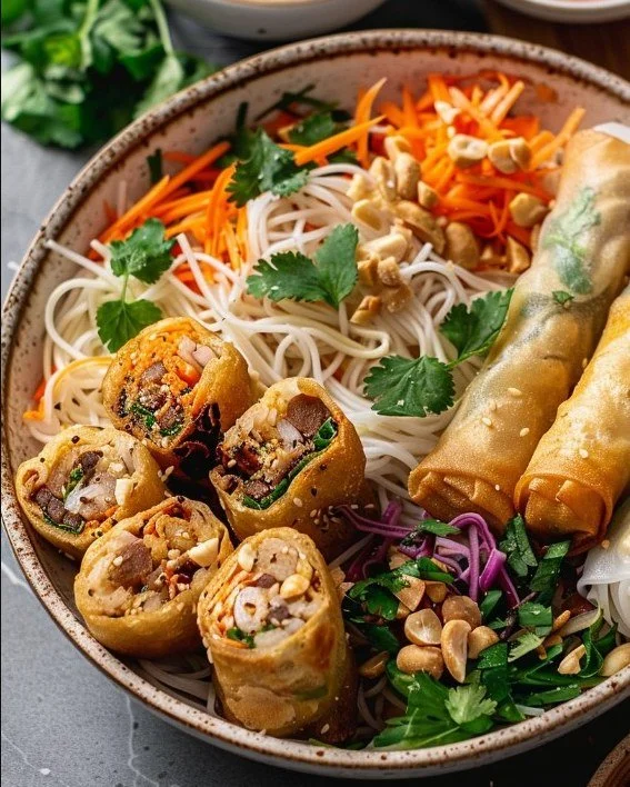 Delicious Thai Peanut Spring Roll Noodle Bowl with fresh vegetables and peanut sauce