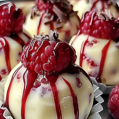 Delicious white chocolate raspberry cheesecake balls ready to serve for dessert.