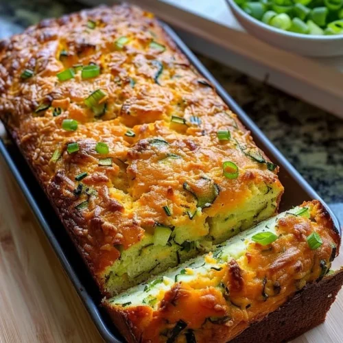 Freshly baked Zucchini Cheese Bread with herbs and cheese